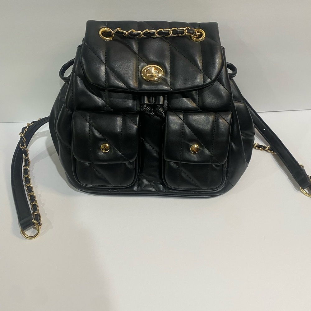 Black Quilted Turn lock Backpack with gold hardware